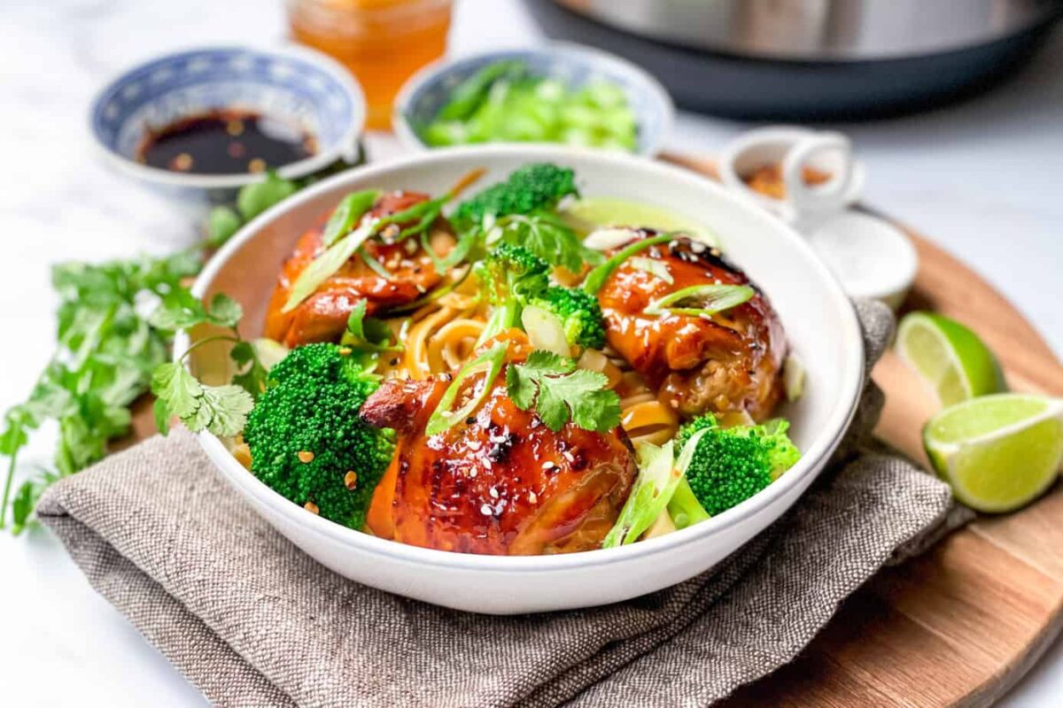 Closeup view of Instant Pot Asian BBQ Chicken Wings with Broccoli and Noodles