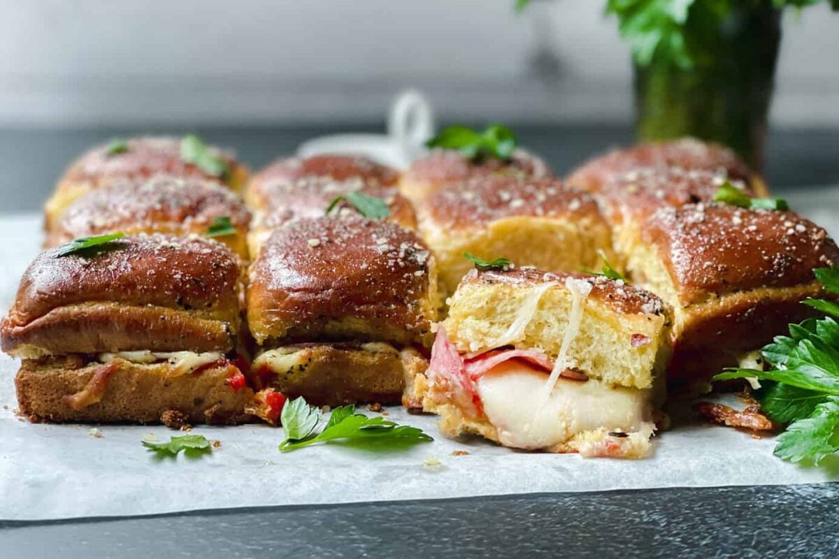 Closeup view of a pull apart Pizza Slider with melting mozzarella cheese