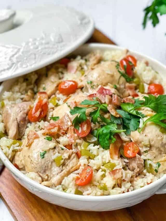 Close up view of Chicken Perloo with fresh parsley in a covered casserole dish