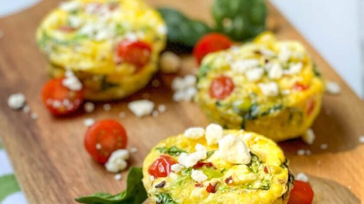 Mediterranean Egg Muffins on a Wood Board
