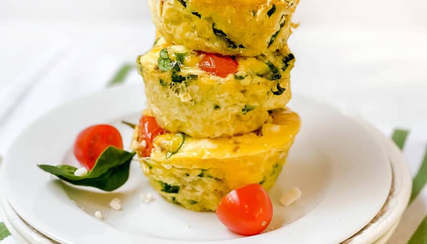 3 stacked Mediterranean Egg Muffins on a white plate