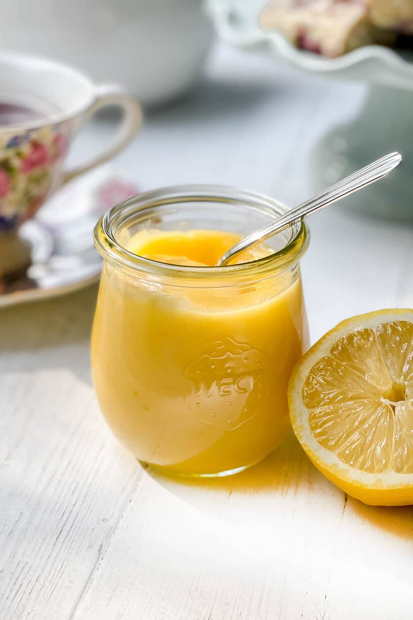 Closeup view of Lemon Curd with a silver spoon