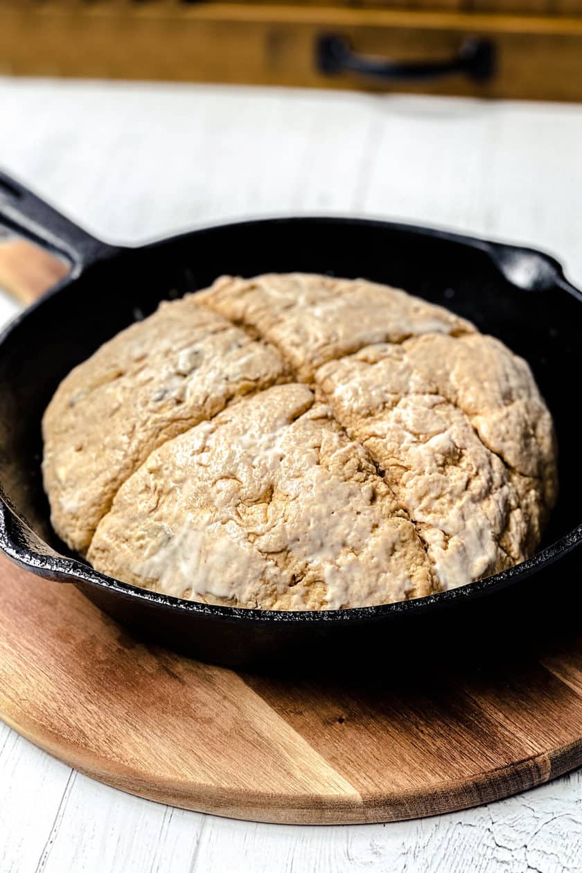 Unbaked Irish Brown Soda Bread with Molasses in a cast iron skillet