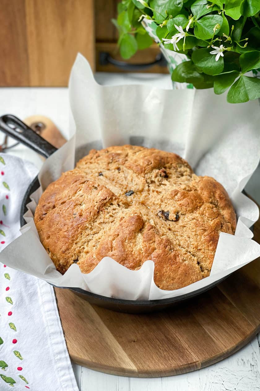 Side view of unsliced Irish Brown Soda Bread with Molasses in a skillet