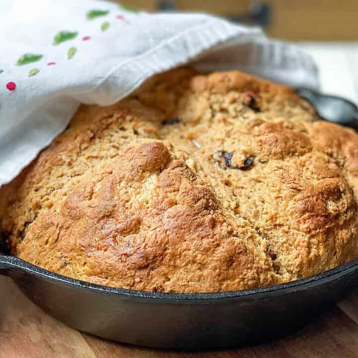 Closeup view of Irish Brown Soda Bread with Molasses in a cast iron skillet