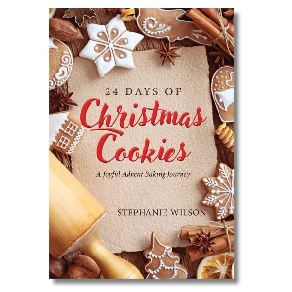 Book cover for "24 Days of Christmas Cookies: A Joyful Advent Baking Journey" by Stephanie Wilson. Features a rolling pin, star anise, cinnamon sticks, assorted gingerbread cookies, and snowflake decorations on a wooden background.