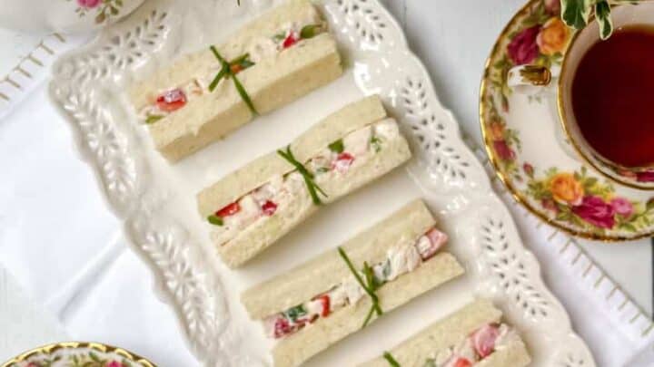 Top view of Strawberry Chicken Salad Tea Sandwiches with chive ribbons