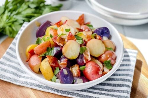 Closeup view of a bowl of German Potato Salad with mult color baby potatoes