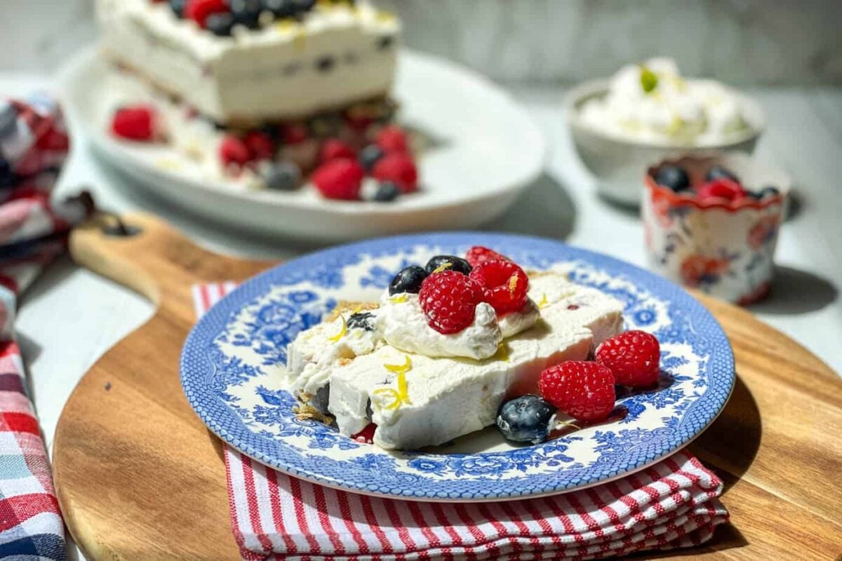 Side view of sliced No Bake Icebox Cake with Summer Berries