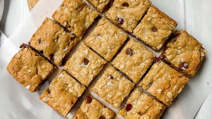 Top view of bar cookies on a wooden board