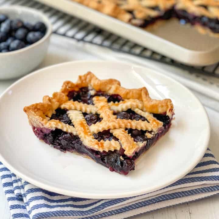 Serving of Blueberry Slab Pie on a white plate