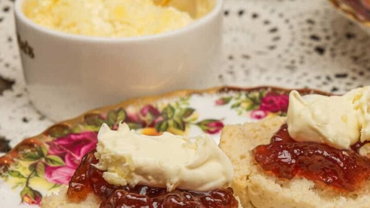 View of cream scones, strawberry jam and clotted cream for afternoon tea