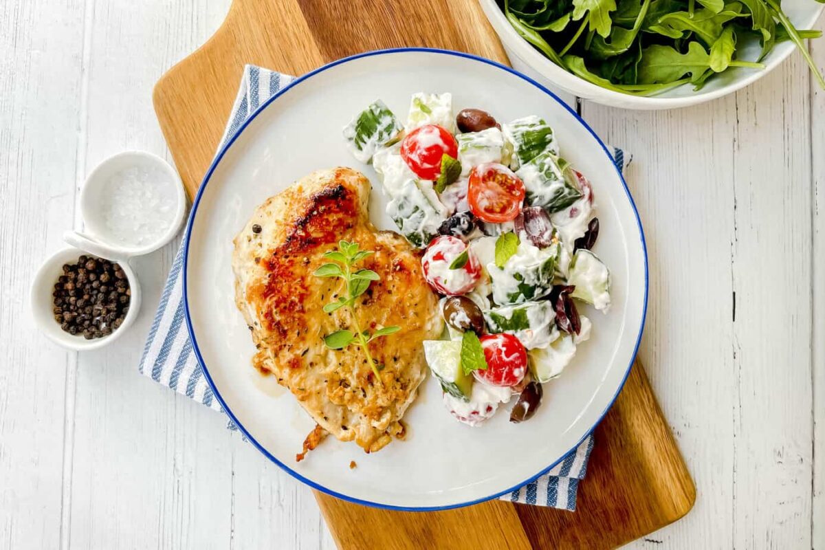 Top view of Greek Chicken with Cucumber Tomato Salad