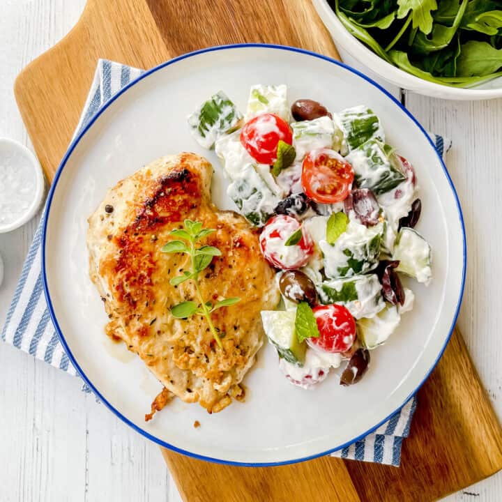 Top view of Greek Chicken with Cucumber Tomato Salad
