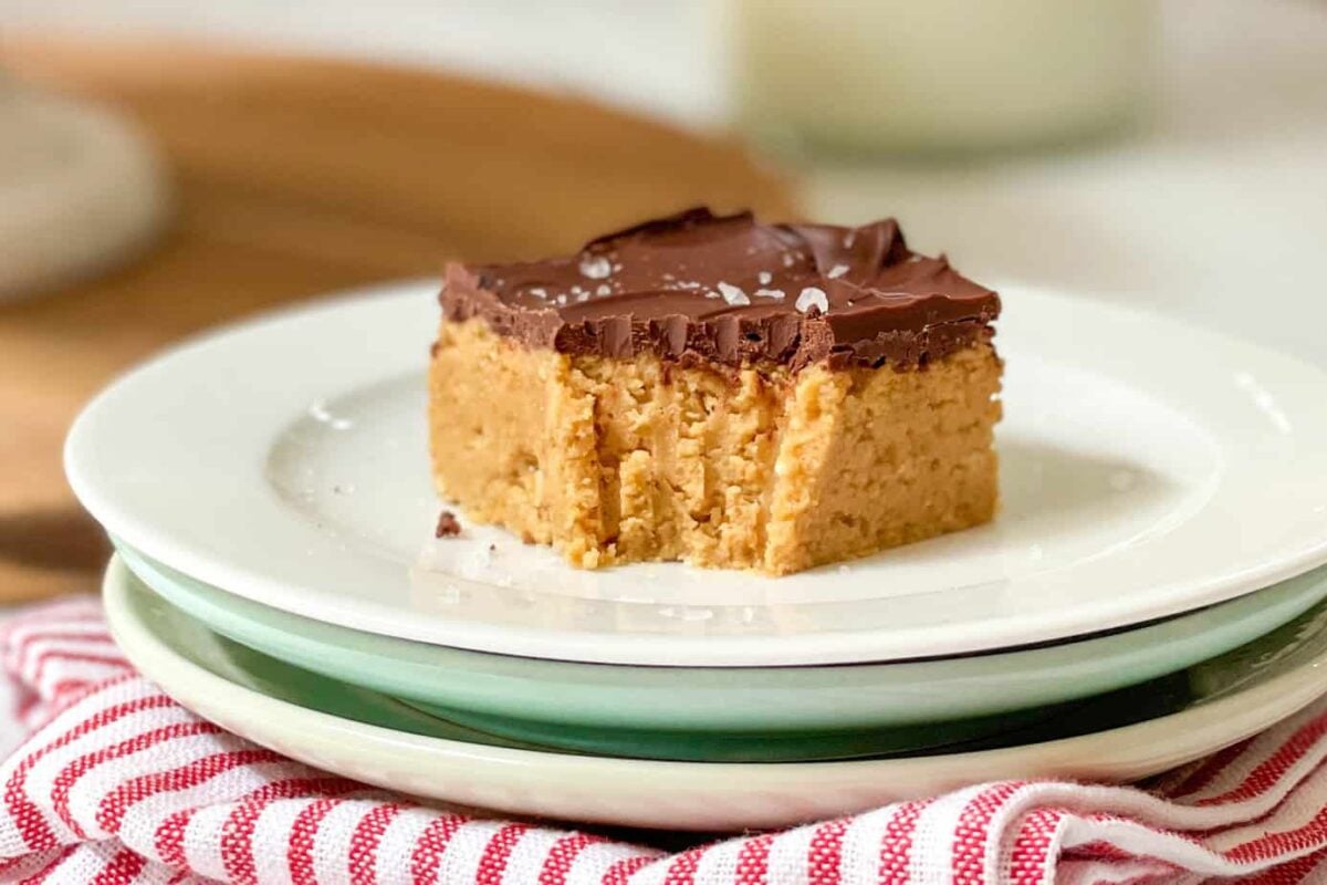 Closeup view of No Bake Chocolate Peanut Butter Bars with bite missing