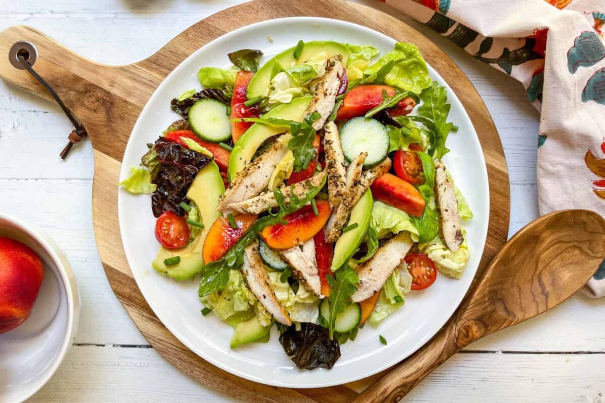 Top view of Stone Fruit Chicken Salad on a white platter