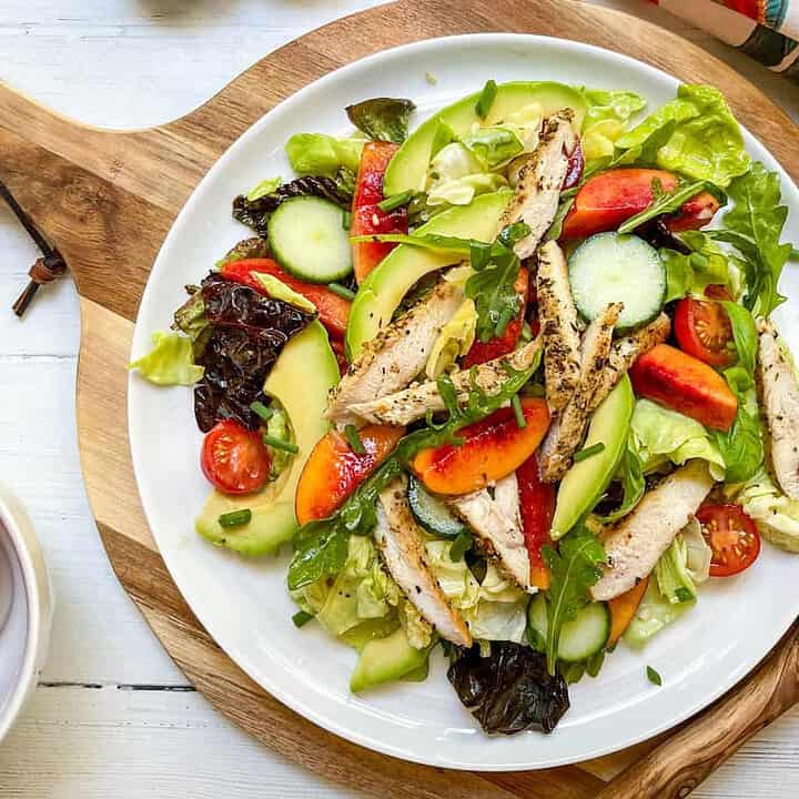 Top view of Stone Fruit Chicken Salad on a white platter
