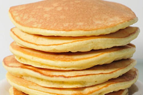 Stack of Queen Elizabeth's drop scones on a plate.