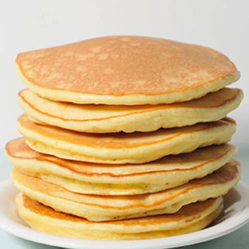 Stack of Queen Elizabeth's drop scones on a plate.