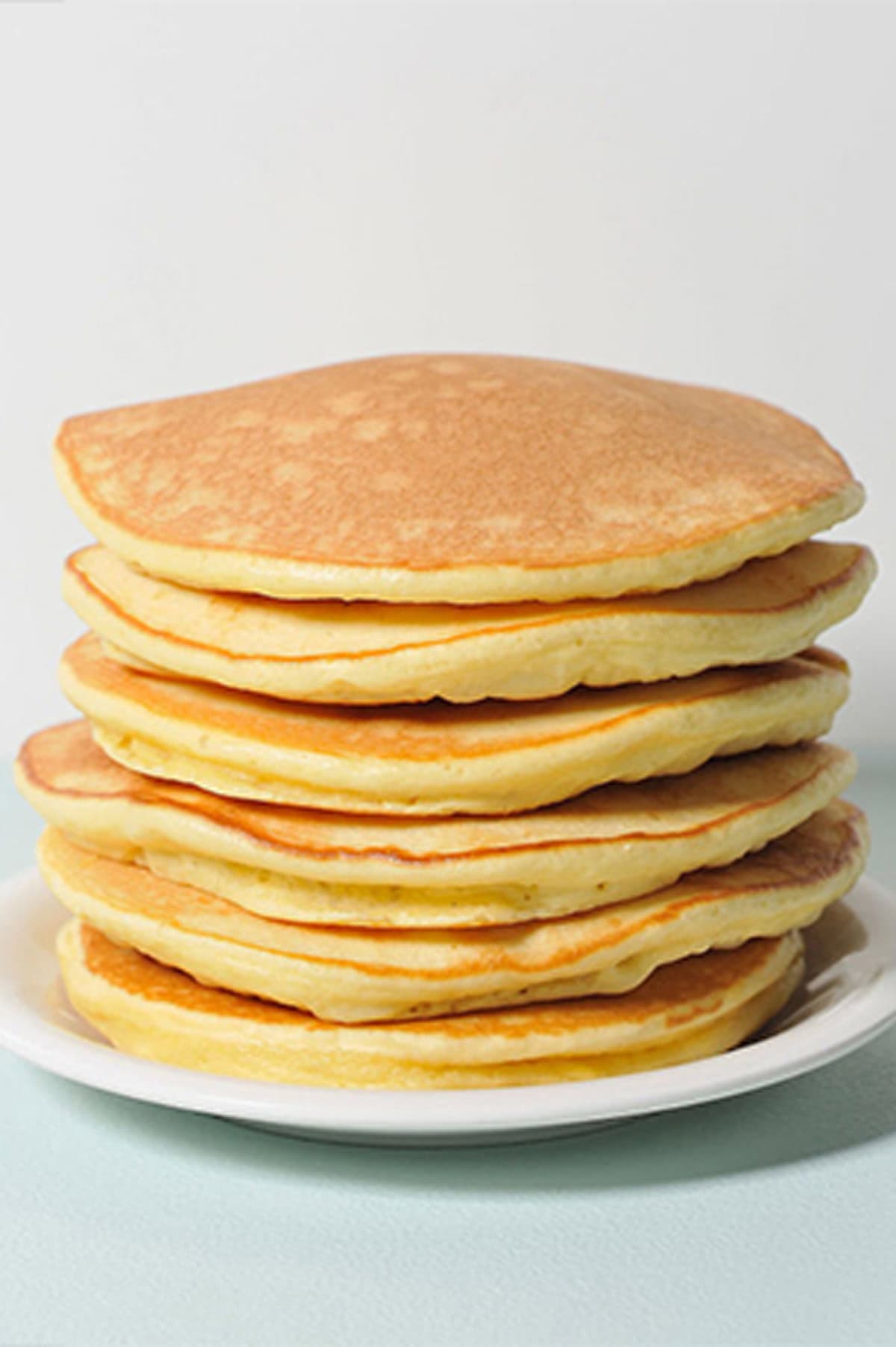 Stack of Queen Elizabeth's drop scones on a plate.