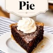 Single-image poster of a rustic brownie pie in a flaky pie crust, dusted with powdered sugar and served with a dollop of whipped cream.