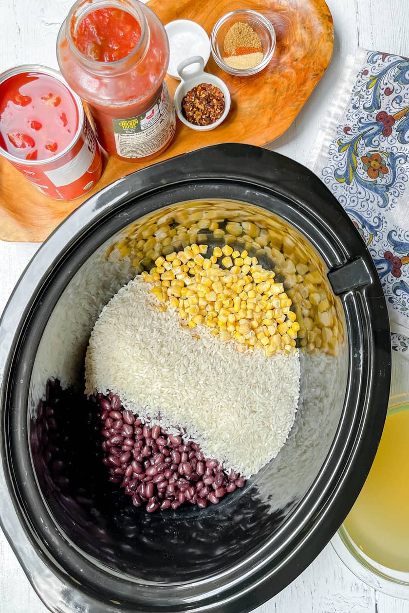 Top view of Slow Cooker Chicken and Rice Burrito Bowl ingredients in the crockpot