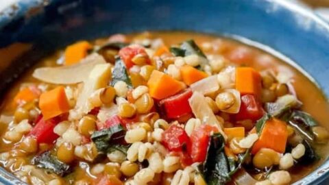 Side view of Barley Lentil Soup in a blue bowl