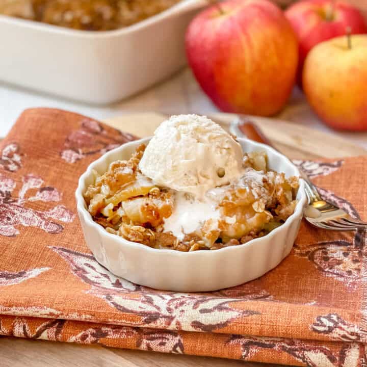 Side view of a serving of Apple Crisp with vanilla ice cream