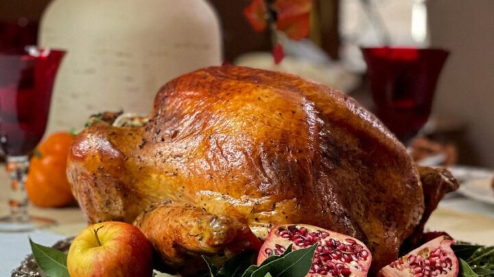 Side view of Herb Roasted Turkey at Thanksgiving Table