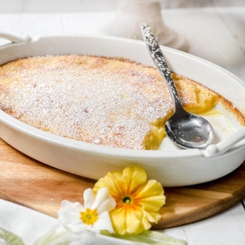 Side view of Baked Lemon Pudding in a white oval baking dish