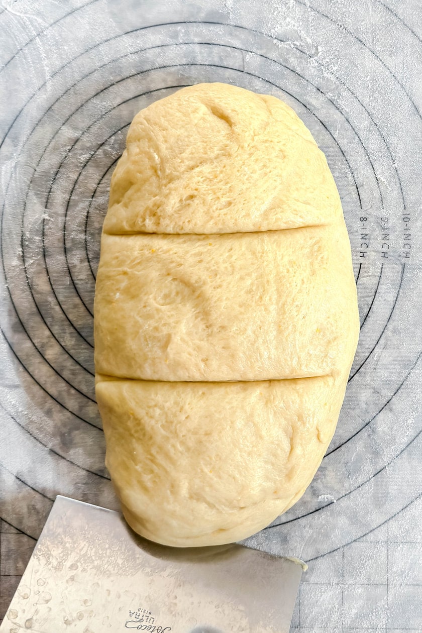 Top view of Easter Bread rough scored into 3 equal pieces