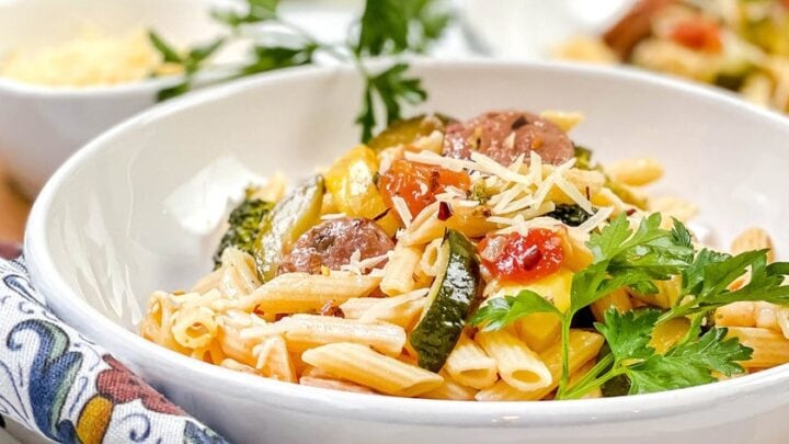 Side view of Sausage pasta in a white pasta bowl