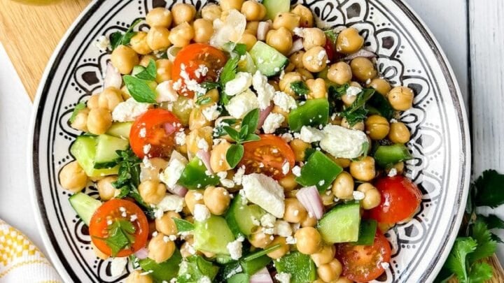 Top vertical view of chickpea salad with fresh herbs, homemade lemon vinaigrette and feta