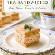 Pinterest pin for Salmon Salad Tea Sandwiches featuring a close-up tea sandwich with creamy salmon and dill filling on a blue-and-white china plate, with elegant title text and a 10-minute recipe note.