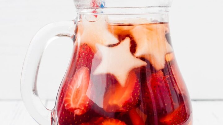 Side view of glass pitcher filled with non alcoholic sangria for the 4th of July