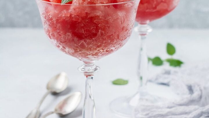 Side view of Watermelon Granita in a crystal glass topped with mint leaves