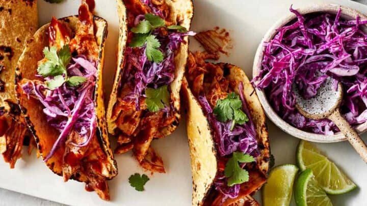 Top view of healthy BBQ Chicken Tacos with red cabbage for July Healthy 20 Minute Dinners: Meal Plan (July 24)