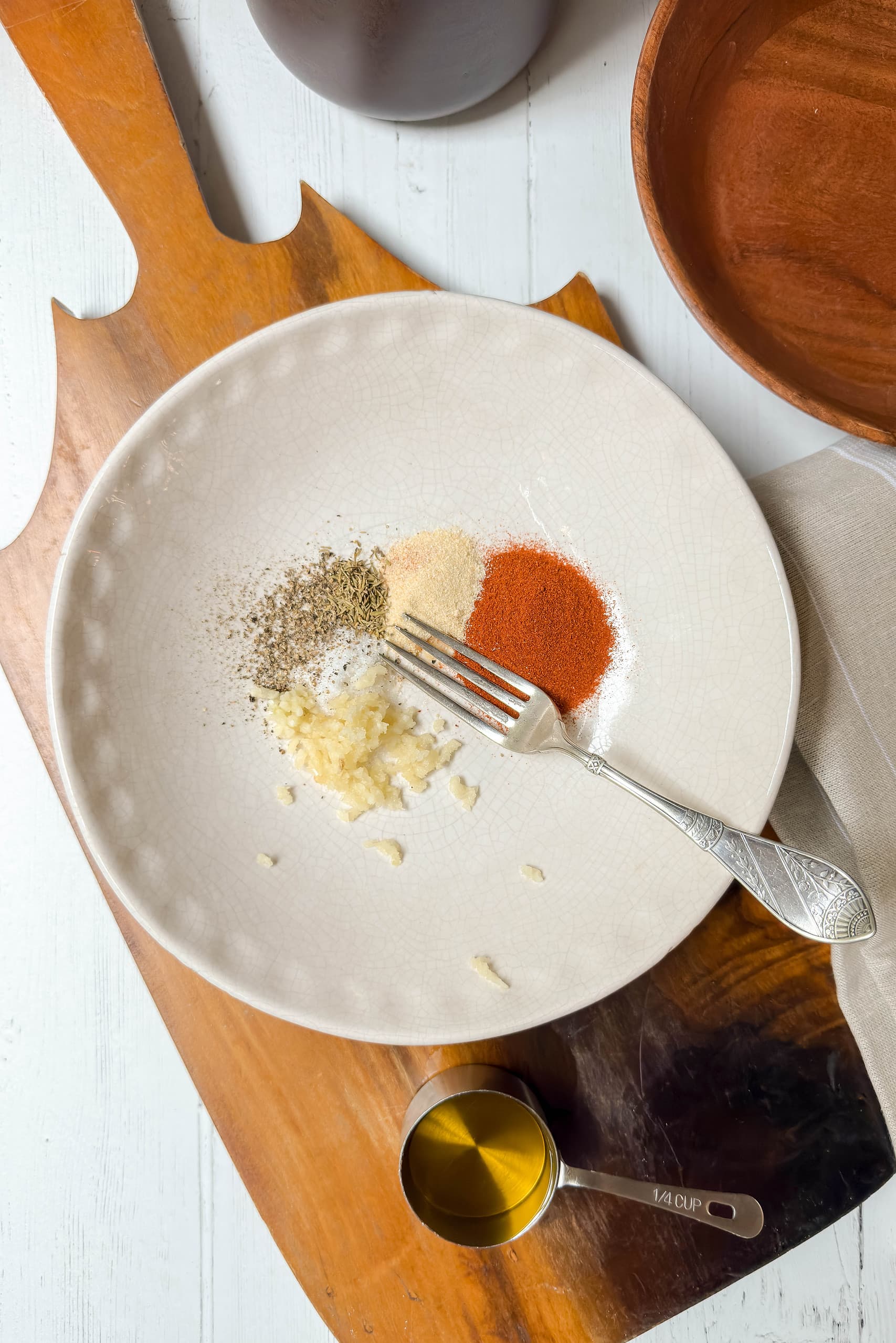 Top view of seasonings in Paprika Sauce in a white bowl