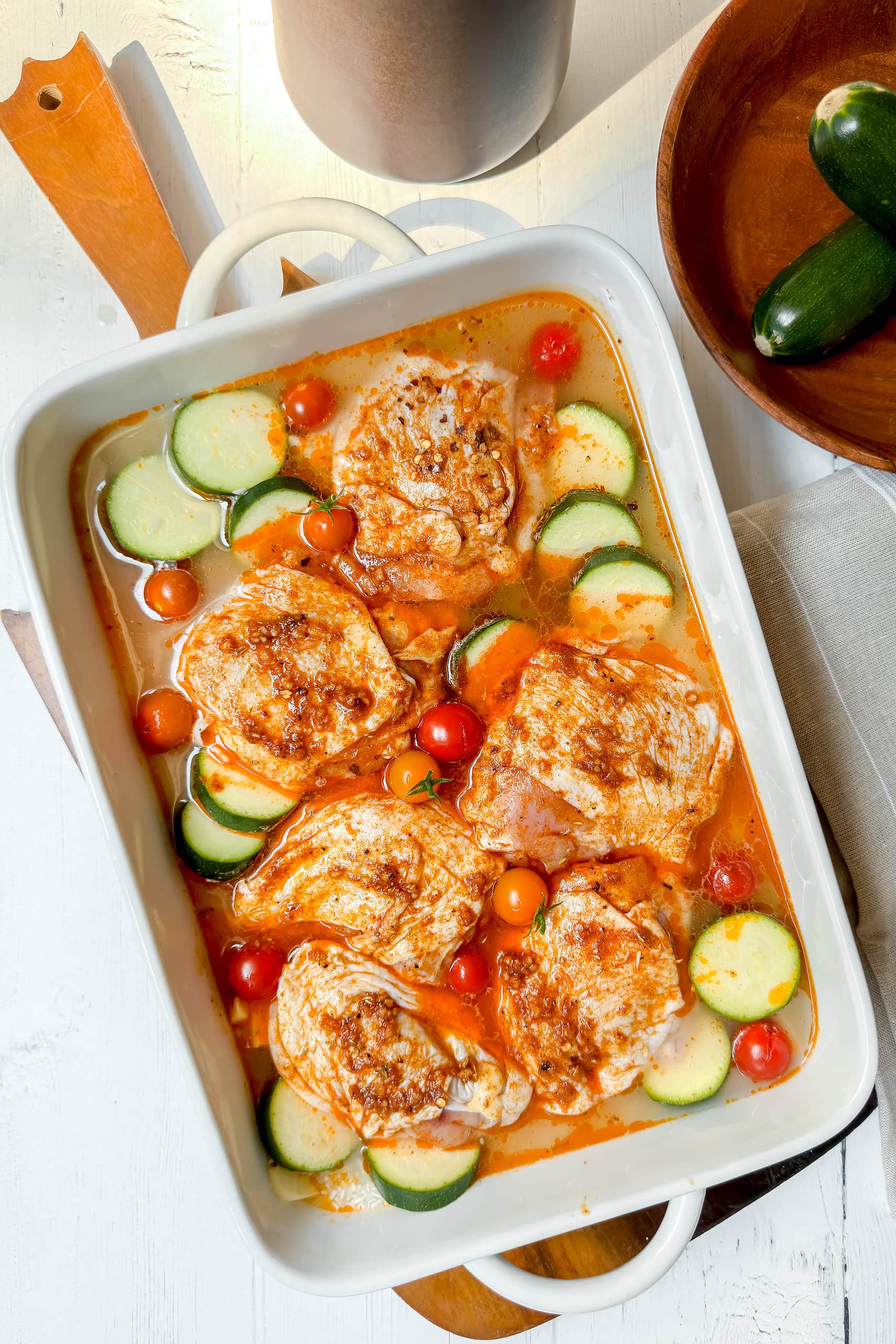 Top view of uncooked One Pan Chicken and Rice in a casserole dish ready for the oven