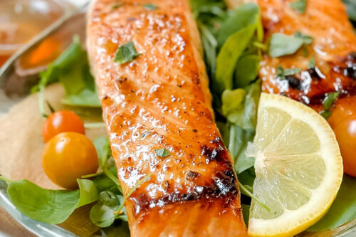 Closeup front view of Honey Garlic Salmon fillet over watercress
