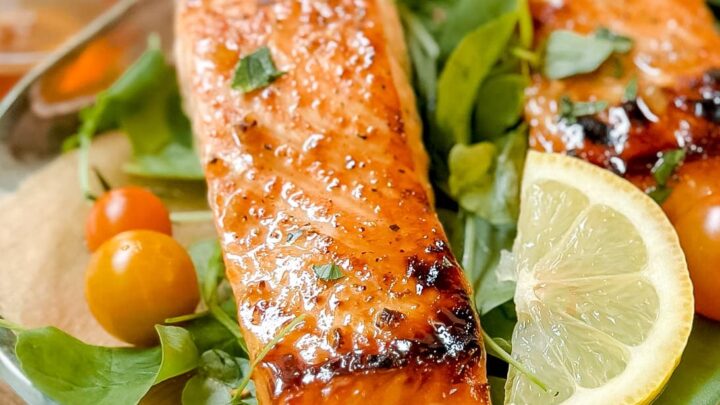 Closeup front view of Honey Garlic Salmon fillet over watercress