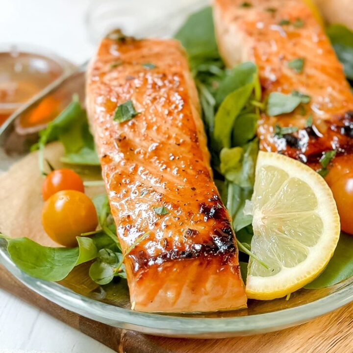 Closeup front view of Honey Garlic Salmon fillet over watercress