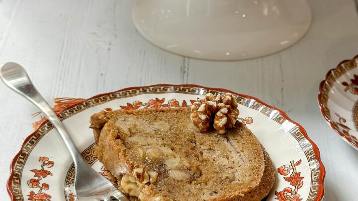 Closeup view of sliced Apple Spice Bundt Cake on Indian Tree china by Spode