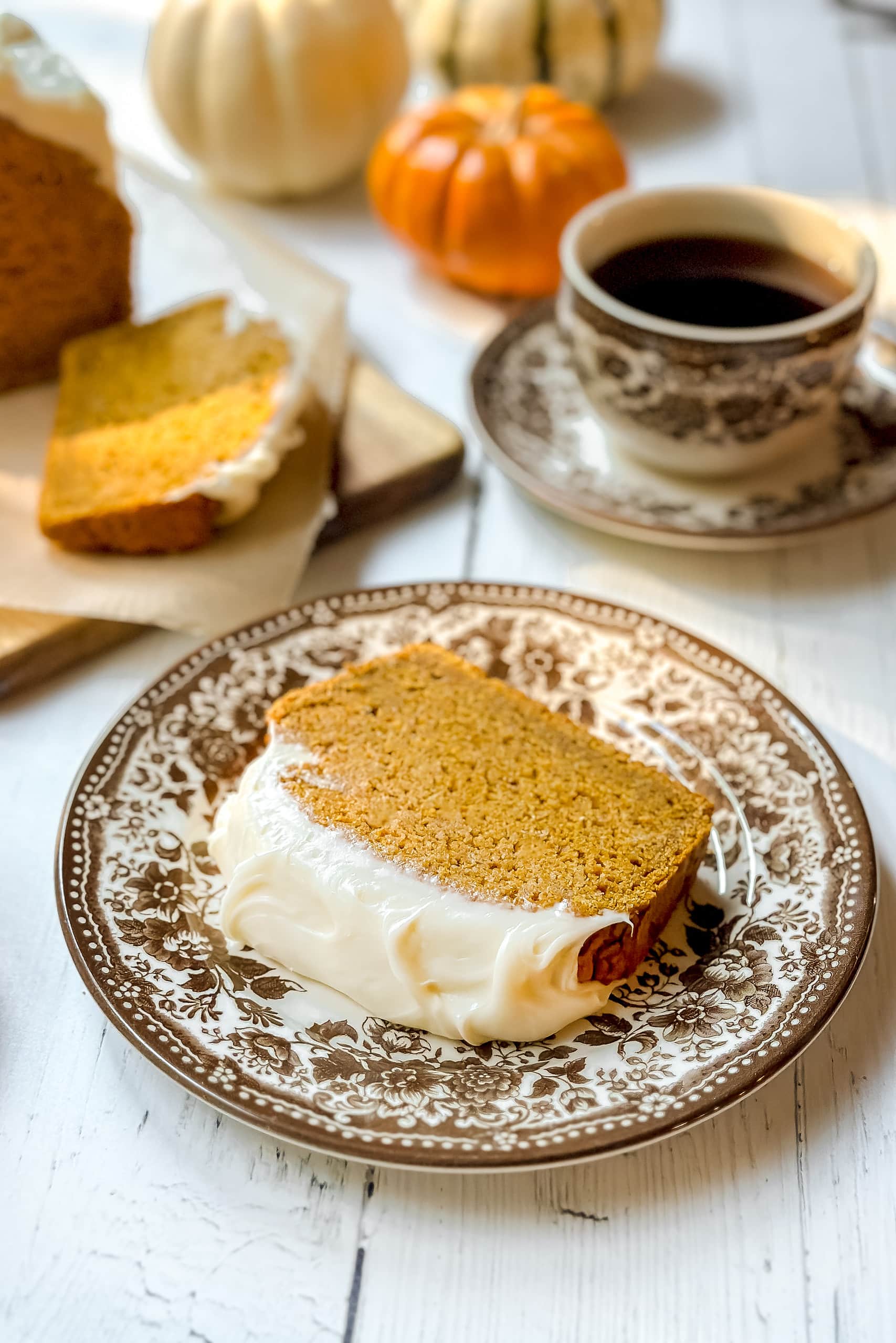 Closeup slice of pumpkin cracker bread topped with cream cheese frosting