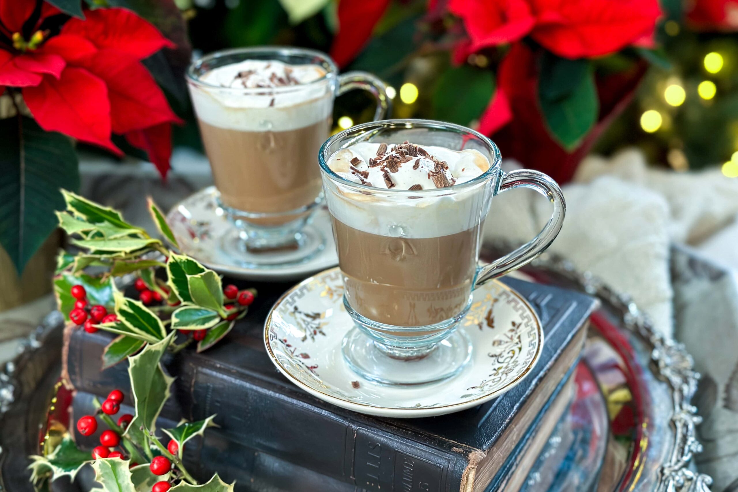 Closeup side view of Christmas Viennese Coffee in glass mugs with whipped cream and chocolate shavings.