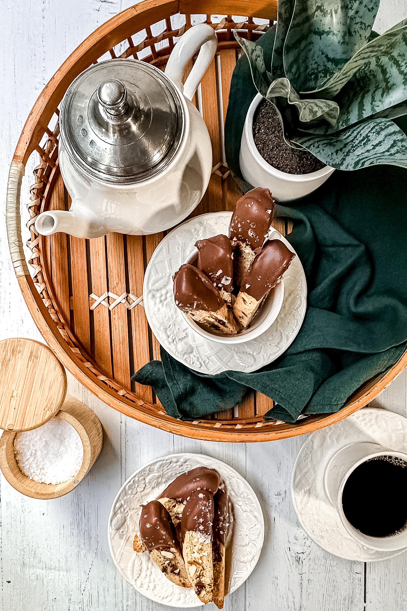 Top view of coffee station with Chocolate Almond Biscotti in a woven tray.