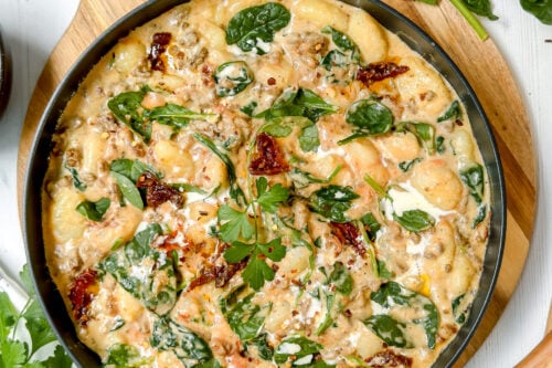 Top view ofEasy Skillet Tuscan Gnocchi Recipe with Sausage in a black skillet.
