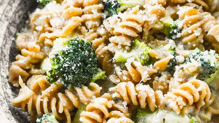Closeup view of broccoli pasta with parmesan cheese.