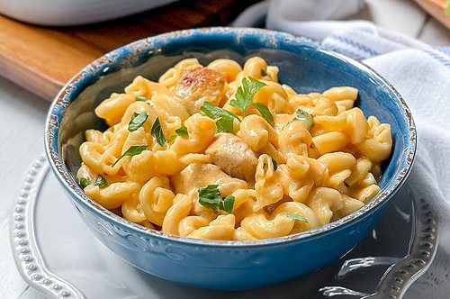 Close up view of Buffalo Chicken Mac and Cheese in a blue bowl for serving.