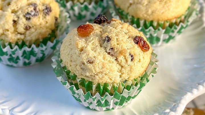 Closeup view of Irish Soda Bread Muffins on a white cake stand.